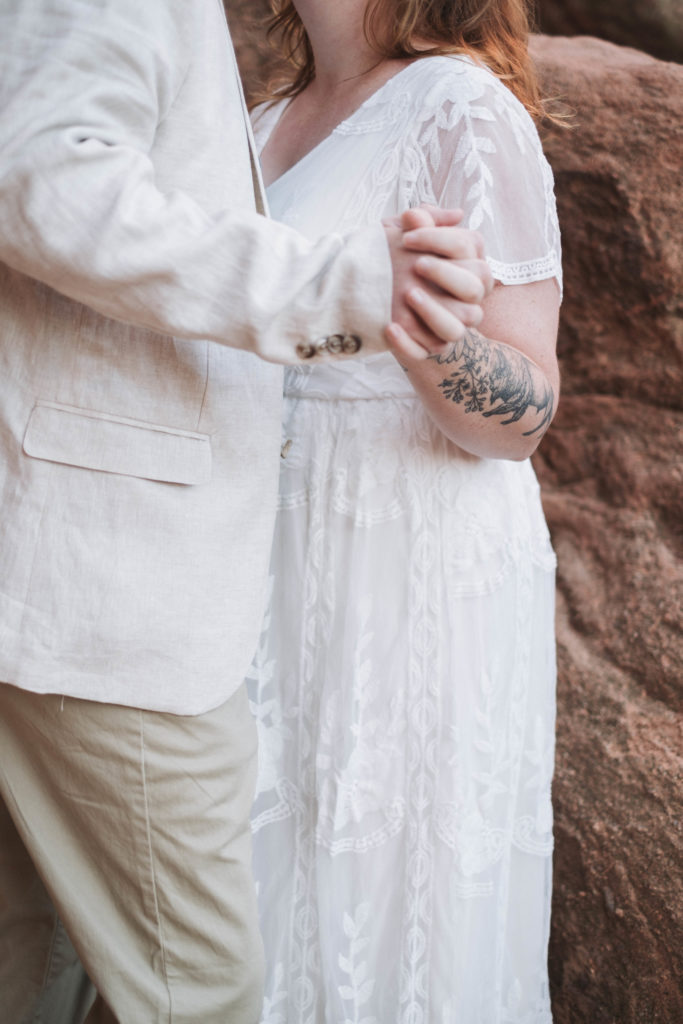 Couple holding hands at Garden of the Gods in Colorado
